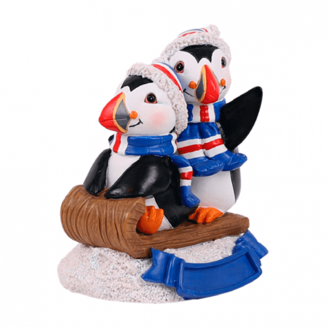 Puffins on a sled statue